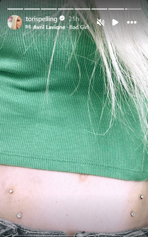 Tori Spelling Flaunts Stomach Piercings 
