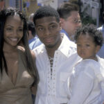Kel Mitchell, Tyisha Hampton and their child attend The Adventures of Rocky & Bullwinkle on June 24, 2000, at Universal City Walk 18 Theatres in Universal City, California