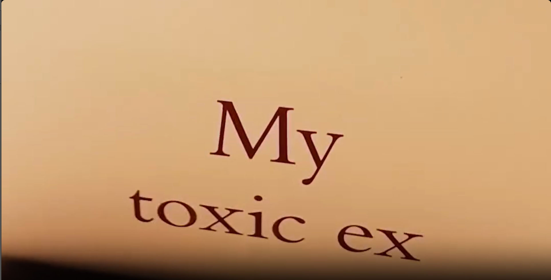 The model shuffled a card that said the words "my toxic ex" on it