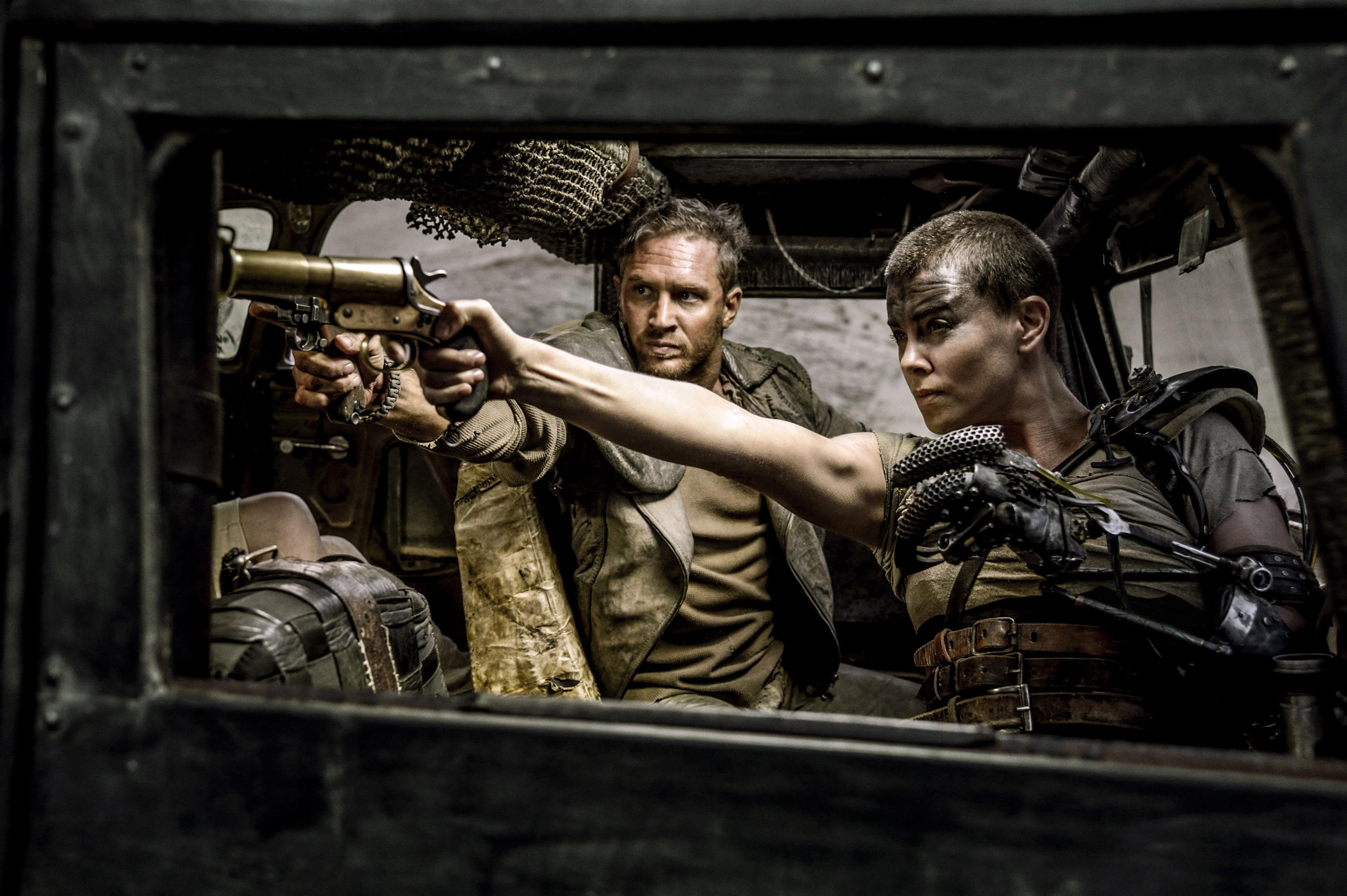 Charlize pictured with Tom Hardy, as Mad Max, in a scene from Fury Road