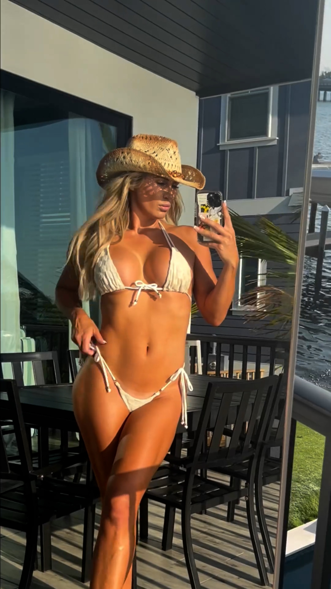 The 35-year-old golf influencer Hart posted an Instagram video of herself posing in a small white bikini while also donning a cowboy hat