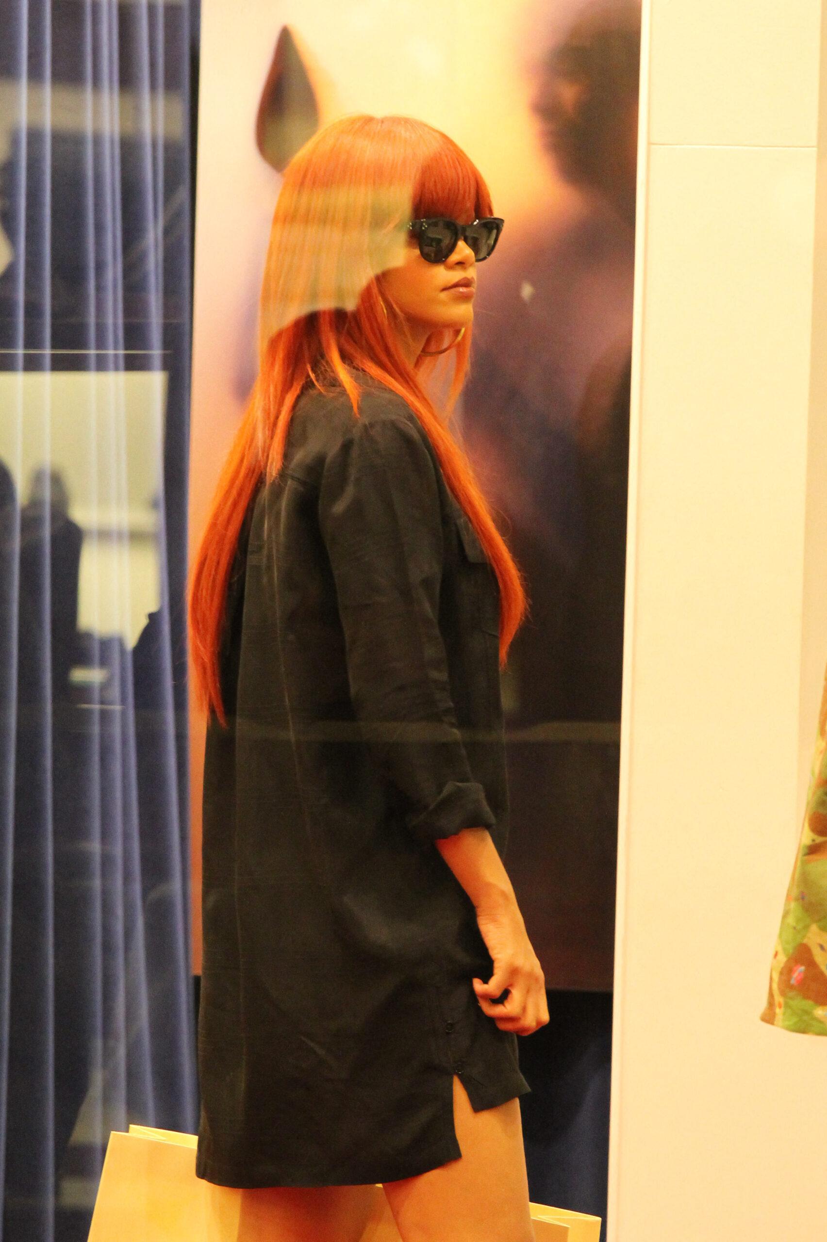 Rihanna wearing a ginger hair and heading out into Sydney's city for a shopping spree