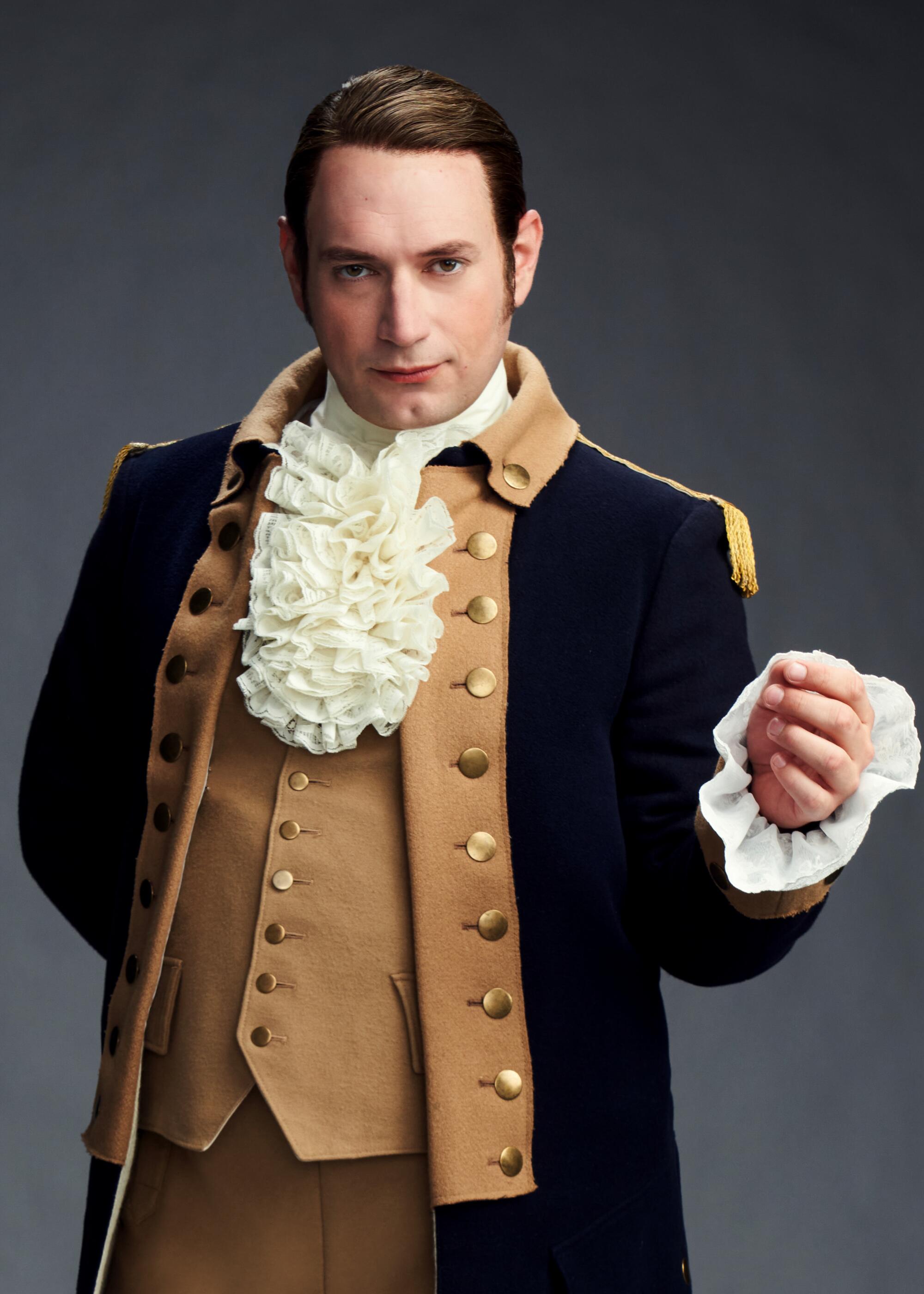 Brandon Scott Jones as Isaac, wears a Revolutionary War uniform.