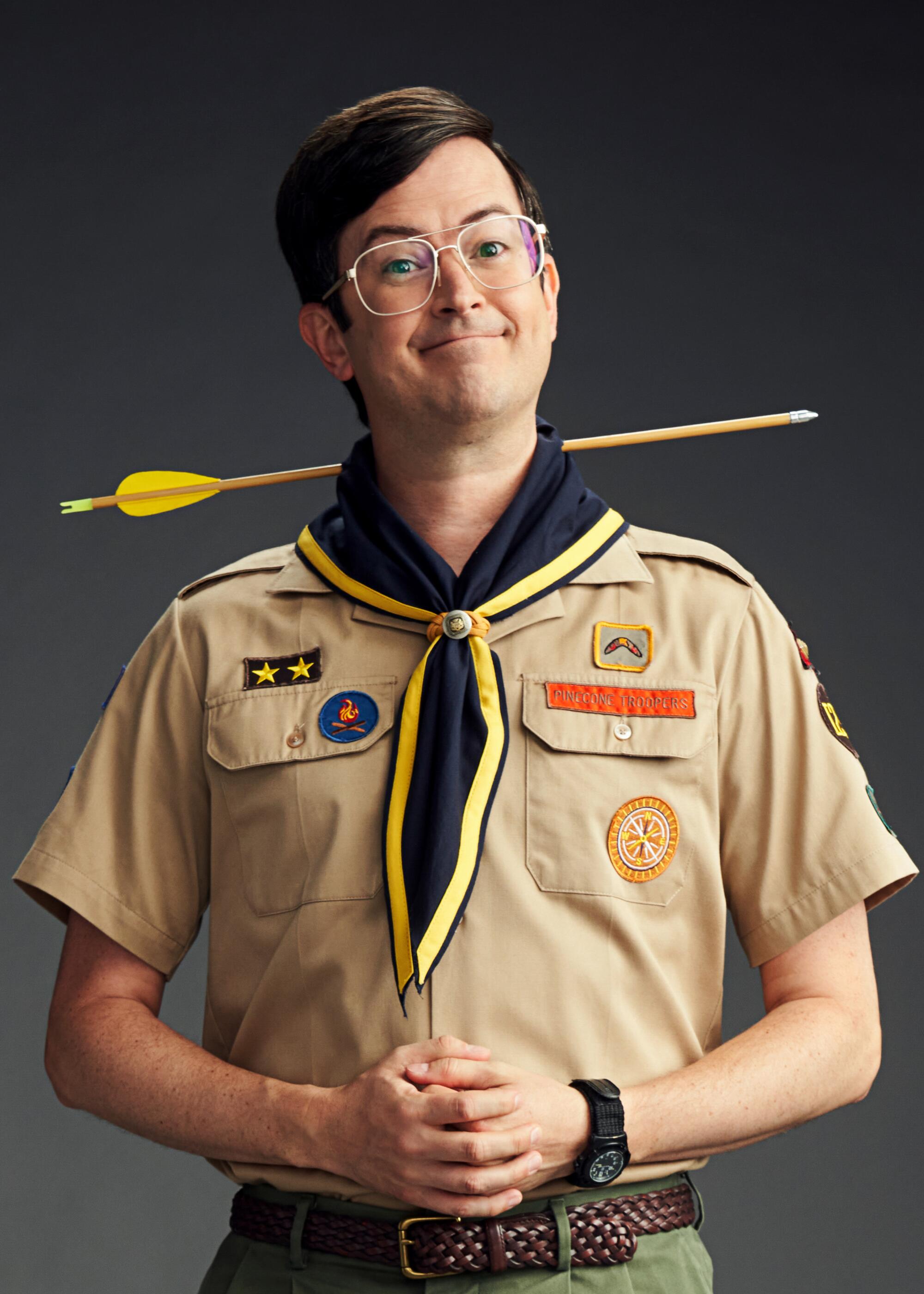 Richie Moriarty as Pete, wears a scout leader uniform and has an arrow going through his neck.