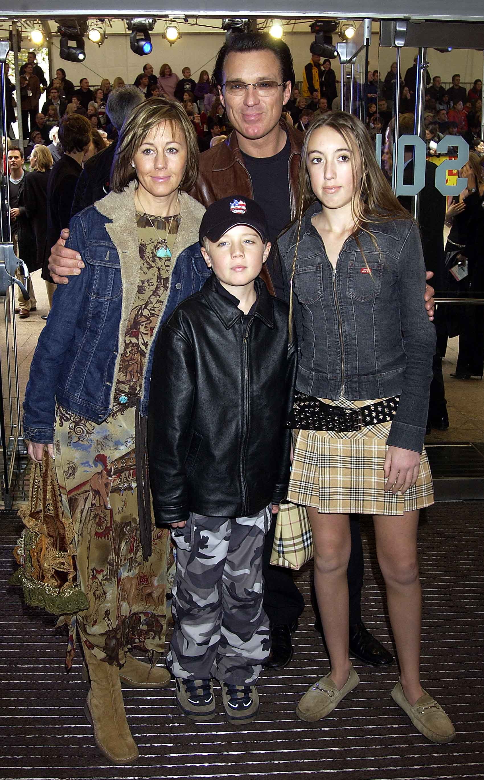  Roman is seen here in 2001 with his famous dad Martin along with his mum and sister