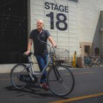 Kelsey Grammer stands with a bicycle outside Paramount Studios' Stage 18, where the new "Frasier" series is shot.