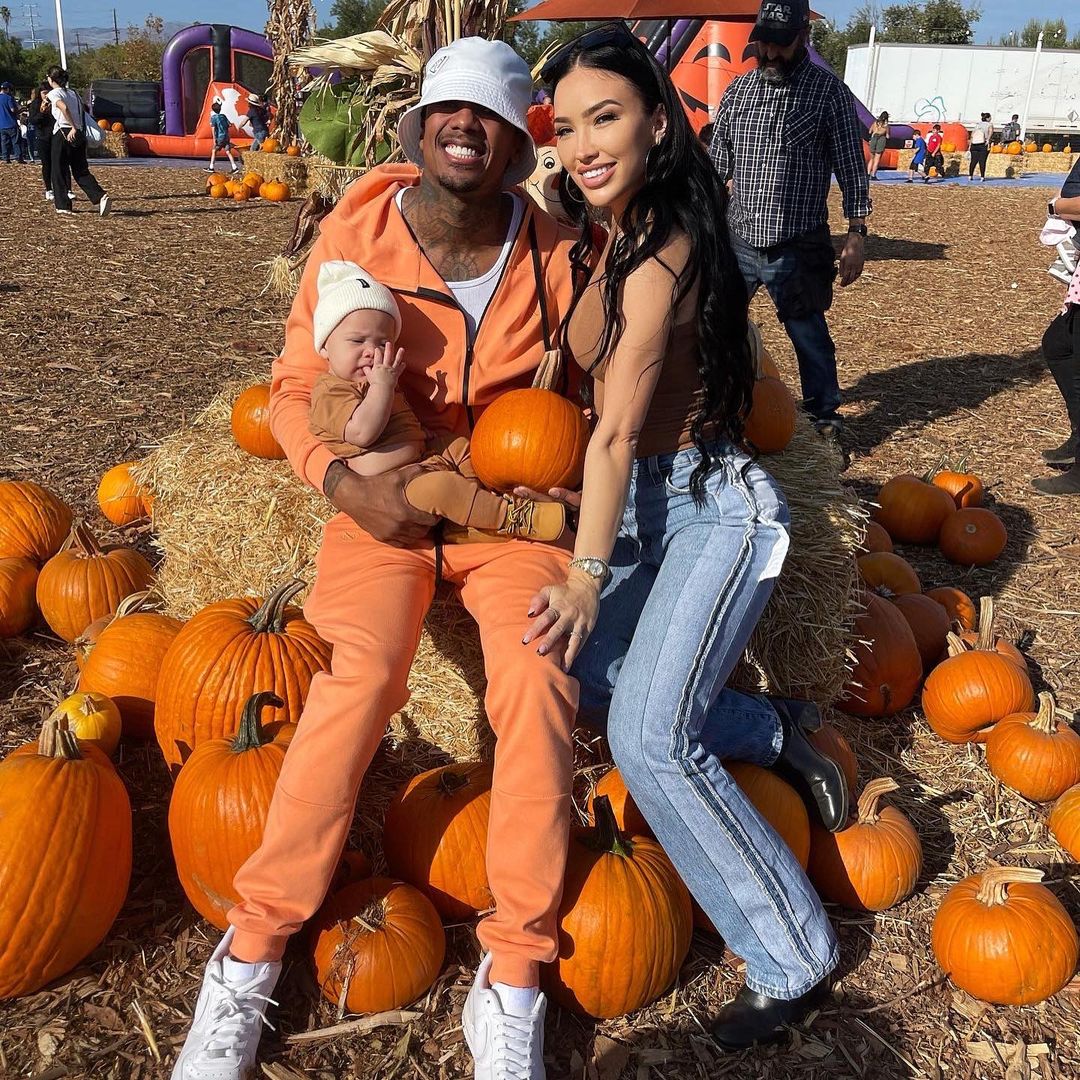 Nick Cannon and Bre Tiesi with their child Legendary at a pumpkin patch