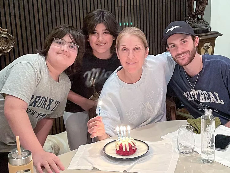 Celine pictured with her three sons, Rene, Eddy, and Nelson, for the documentary I am: Celine Dion