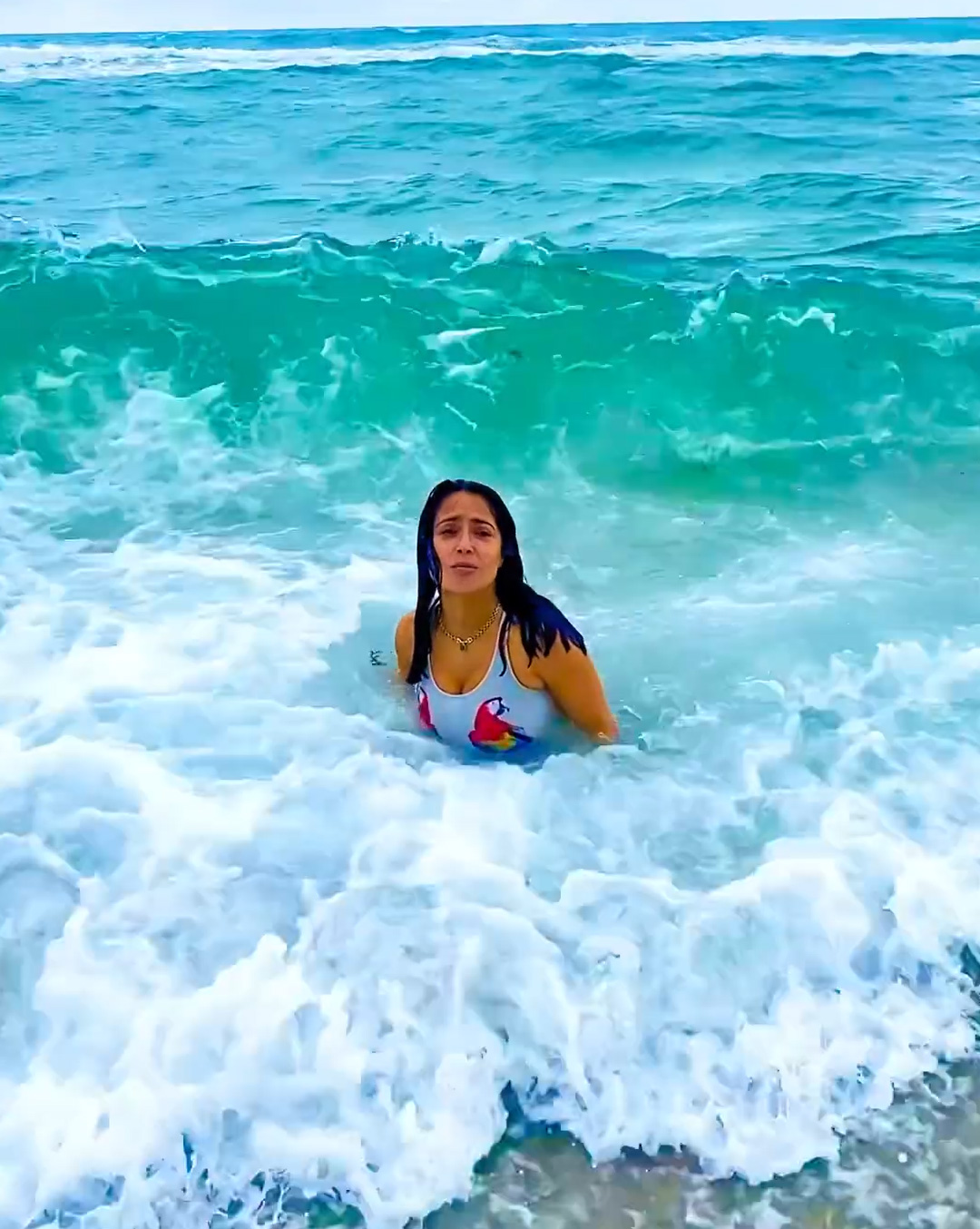 The actress's friend could be heard laughing as she recorded Salma being being tossed around by the ocean