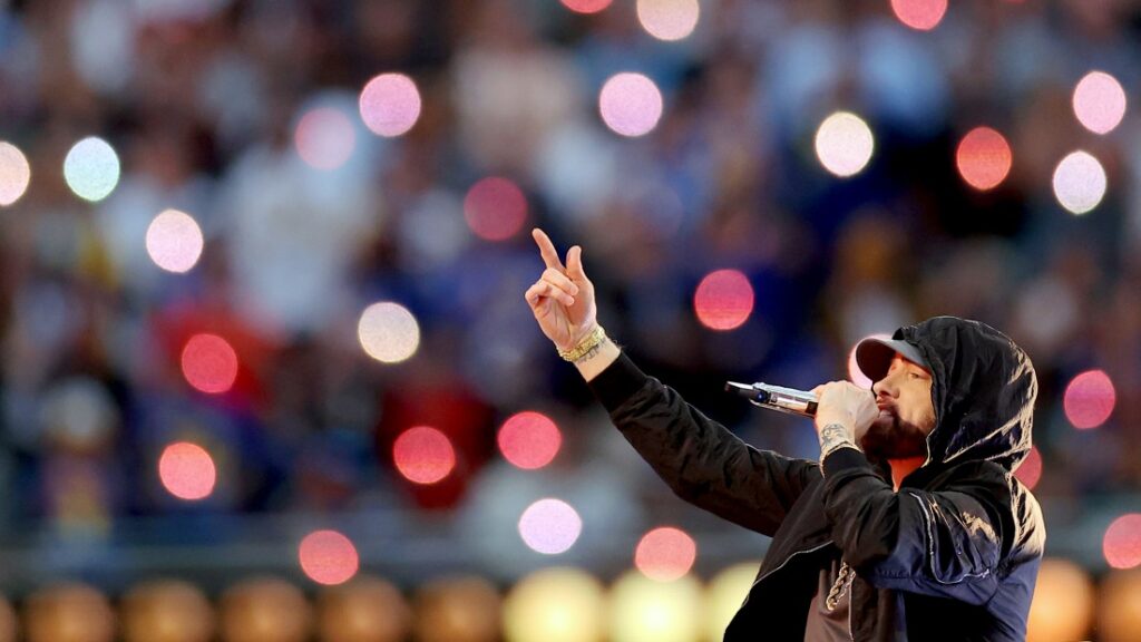 Eminem, performing here during the Super Bowl LVI Halftime Show at SoFi Stadium in 2022, returns to the top 10 of the Billboard Hot 100 chart this week with