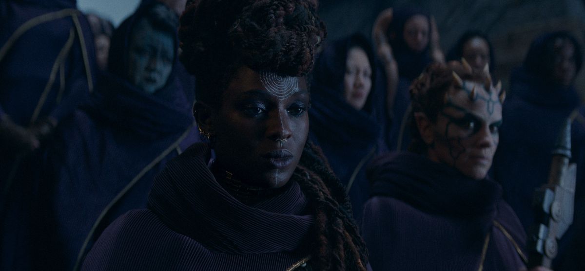 A group of Force-using witches stand together in The Acolyte, with Mother Aniseya (Jodie Turner-Smith) and Koril (Margarita Levieva) at the front of the group