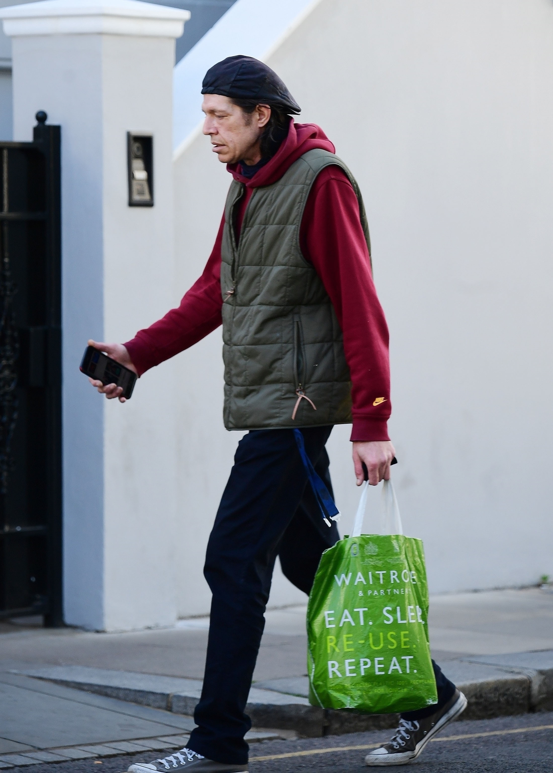 A downcast-looking Christopher was seen carrying a grocery store bag