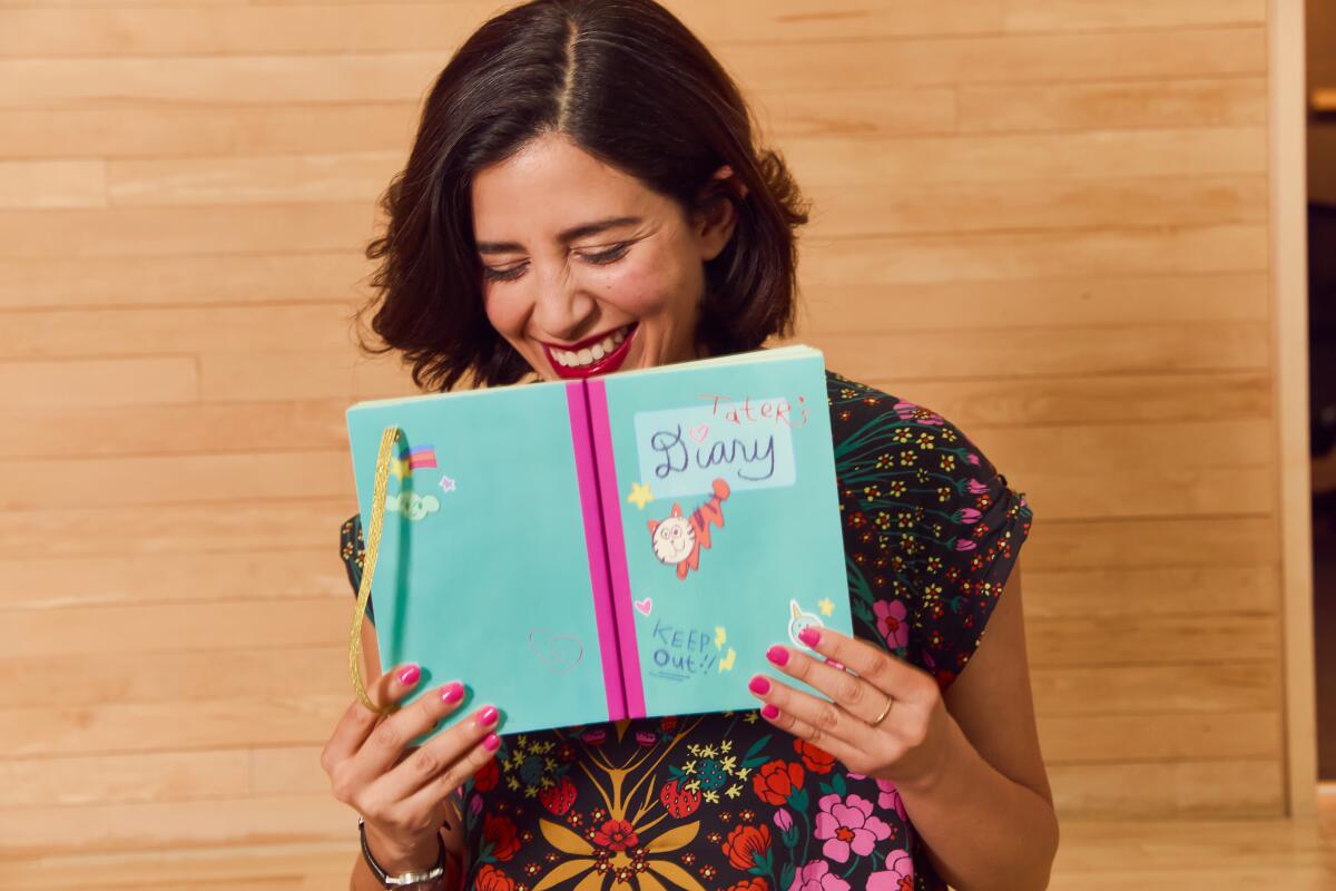 Natasha Kline holding up Tater's diary