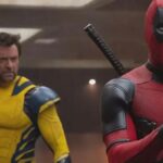 Wolverine (Hugh Jackman) with Deadpool (Ryan Reynolds) who is holding a TVA Tempad.