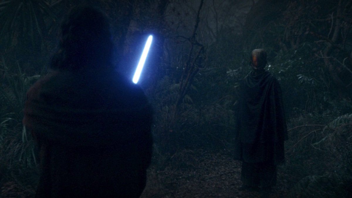 Sol holds his blue lightsaber out whole facing the Master on The Acolyte