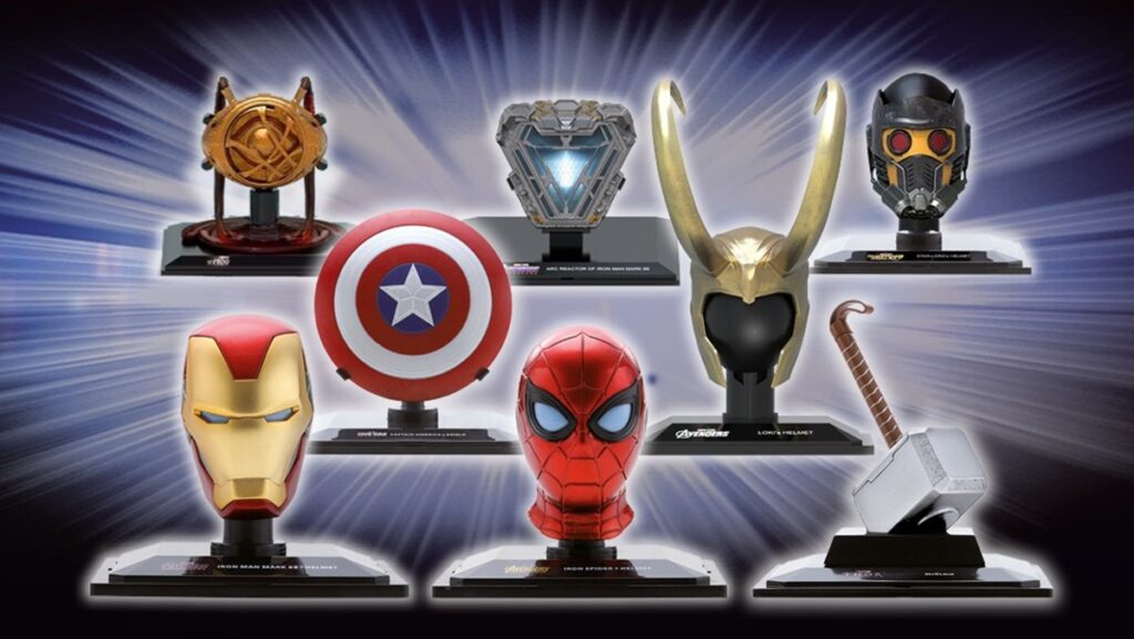Marvel Movie Replicas of the Eye of Agamotto, the ARC reactor, Ant-Man's helmet, Iron Man's helmet, Spider-Man's mask, and Thor's hammer.