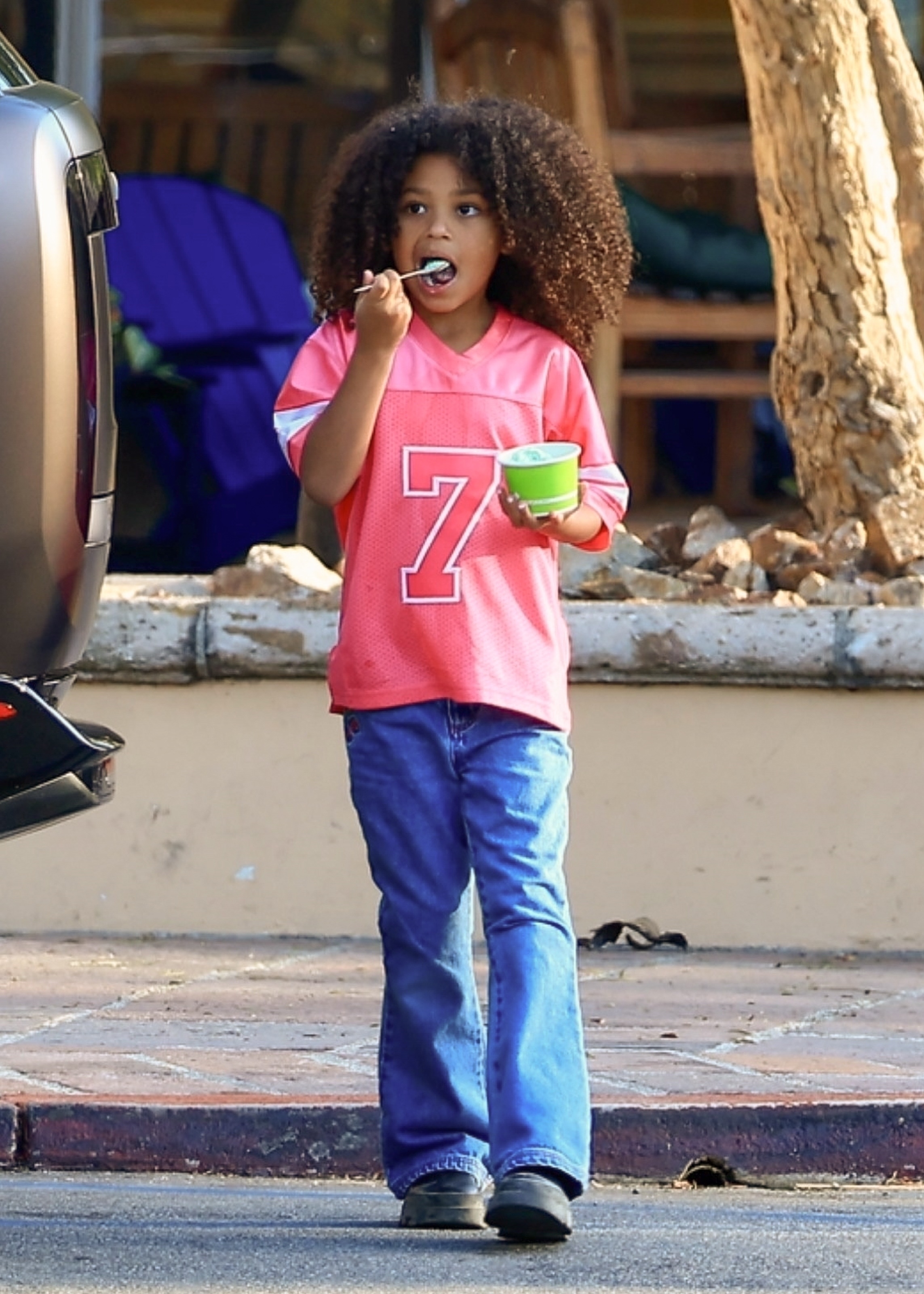 Stormi Webster takes a bite of ice cream as she enjoys a mommy-and-me outing with Kylie Jenner; Aire Webster was not spotted with his mom or sister