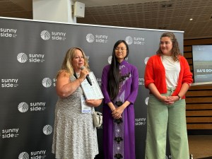 Producer Ina Fichman (L) and director Ashley Duong (center) accept the Student Choice Award for 'Ba's Book'