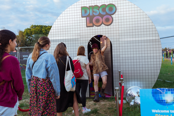 The Disco themed loo at Glastonbury boasts shiny mirrored walls, disco balls, coloured spotlights and neon wall art