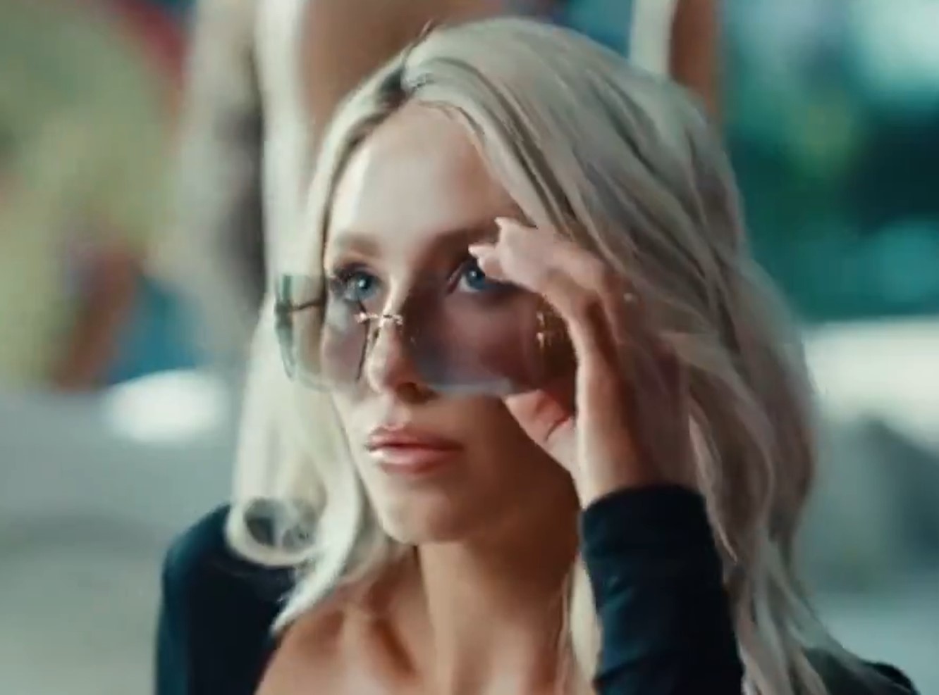 Dunne appeared in the video alongside fellow SI Swimsuit model Alix Earle