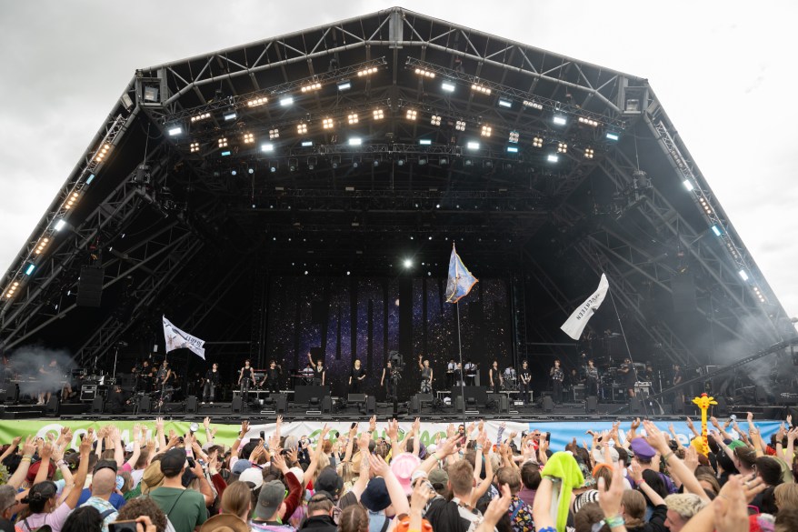 Members of K-Pop group Seventeen perform on the Pyramid Stage.