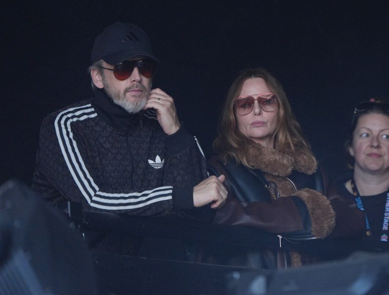 Stella McCartney and her husband Alasdhair Willis watching PJ Harvey perform.