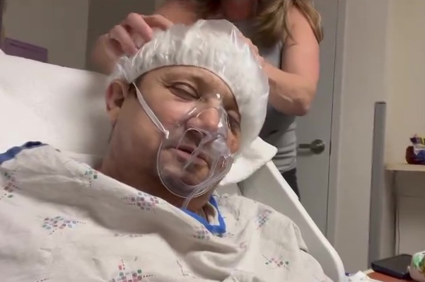 The actor receiving a head massage in hospital