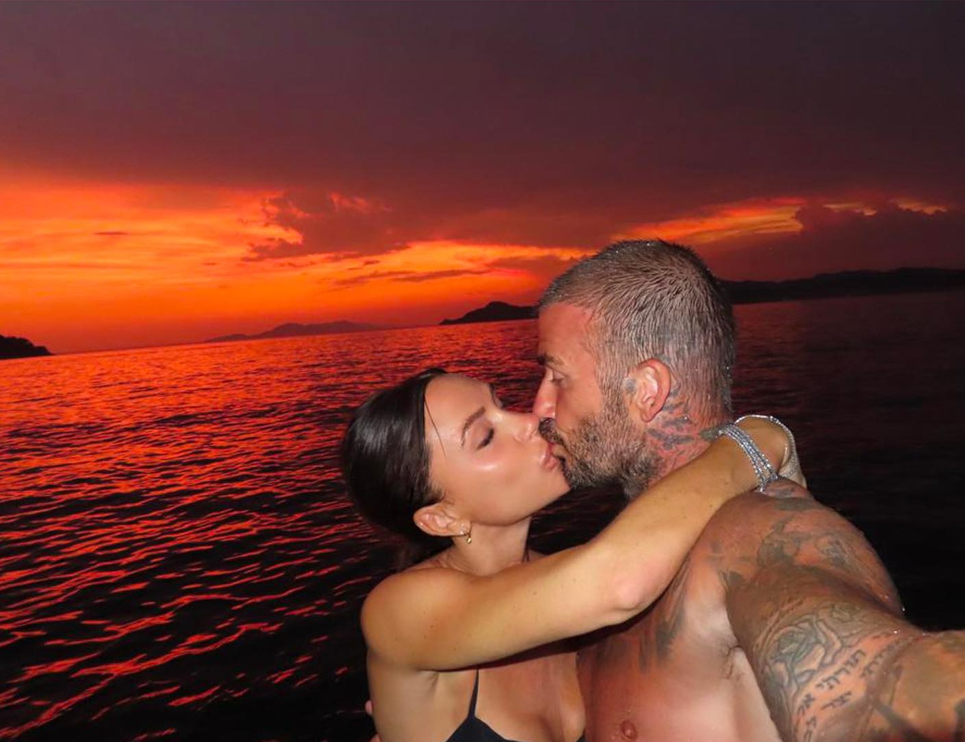 The couple exude a happy glow in sunset PDA from a 2023 Croatia holiday