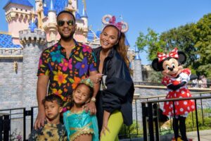 John Legend, Chrissy Teigen and their children, Miles and Luna, photographed at Disneyland on April 14, 2022 in Anaheim, California.