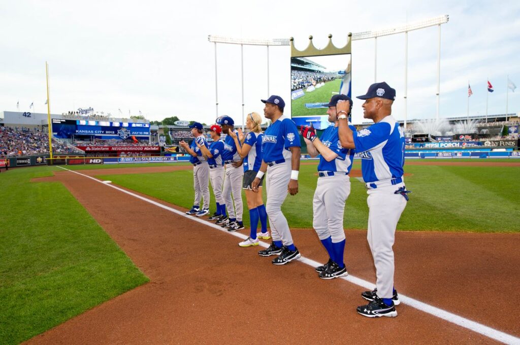 All-Star Legends and Celebrities are seen on the third base line during the opening ceremony for the 2012 Taco Bell All-Star Legends & Celebrity Softball Game at Kauffman Stadium on Sunday, July 8, 2012 in Kansas City, Missouri.