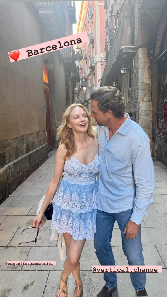 Heather Graham showed off her ageless beauty in a plunging dress while on vacation in Barcelona