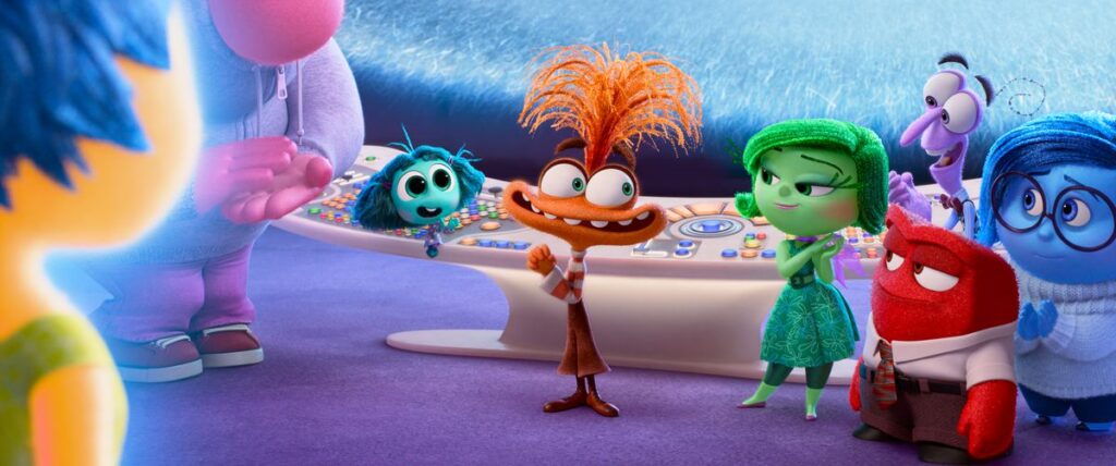 The legacy emotions from Pixar’s Inside Out all gather around a new arrival, the orange-skinned, Muppety-looking Anxiety, in Pixar Animation Studios’ Inside Out 2