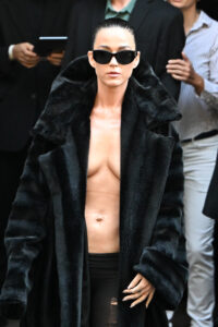 Katy Perry wearing no shirt and a fur coat at the Balenciaga Haute Couture Fall/Winter 2024-2025 show