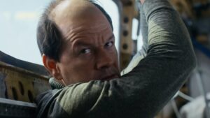 Mark Wahlberg Goes Bald in Flight Risk Trailer