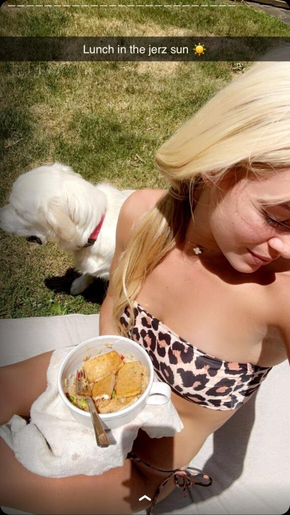 Olivia Dunne enjoys her lunch outdoors.