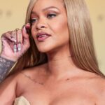 A close up of Rihanna on the red carpet at Rihanna x Fenty Beauty New Product Launch For Fenty Beauty Soft'Lit Naturally Luminous Longwear Foundation