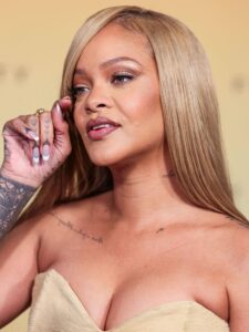 A close up of Rihanna on the red carpet at Rihanna x Fenty Beauty New Product Launch For Fenty Beauty Soft'Lit Naturally Luminous Longwear Foundation