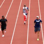 Wallace Spearmon, Snoop Dogg and Ato Boldon run on the track Sunday on Day 3 of the U.S. Olympic Team Trials Track & Field at Hayward Field in Eugene, Oregon.