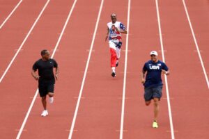 Wallace Spearmon, Snoop Dogg and Ato Boldon run on the track Sunday on Day 3 of the U.S. Olympic Team Trials Track & Field at Hayward Field in Eugene, Oregon.