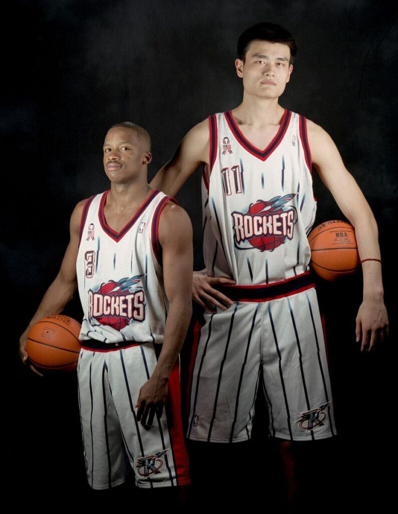 Yao Ming joins Steve Francis at the Compaq Center before the start of the 2002 season. The Rockets selected Yao with the first overall pick in the draft.