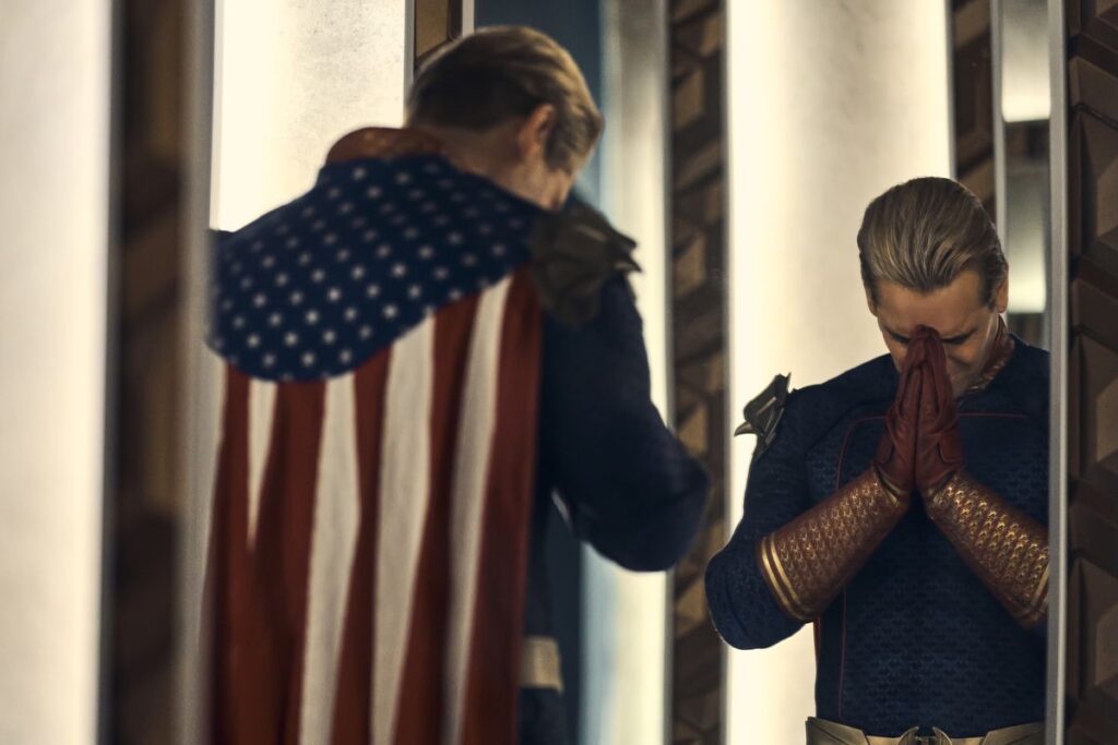 Homelander prays in front of a mirror in a scene from season 4 of The Boys