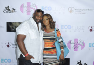 Marcello Thedford and Trina McGee attend EcoLuxe Lounge #ChristmasinSeptember Presented By Shriners Hospitals For Children LA on September 19, 2015, in Hollywood