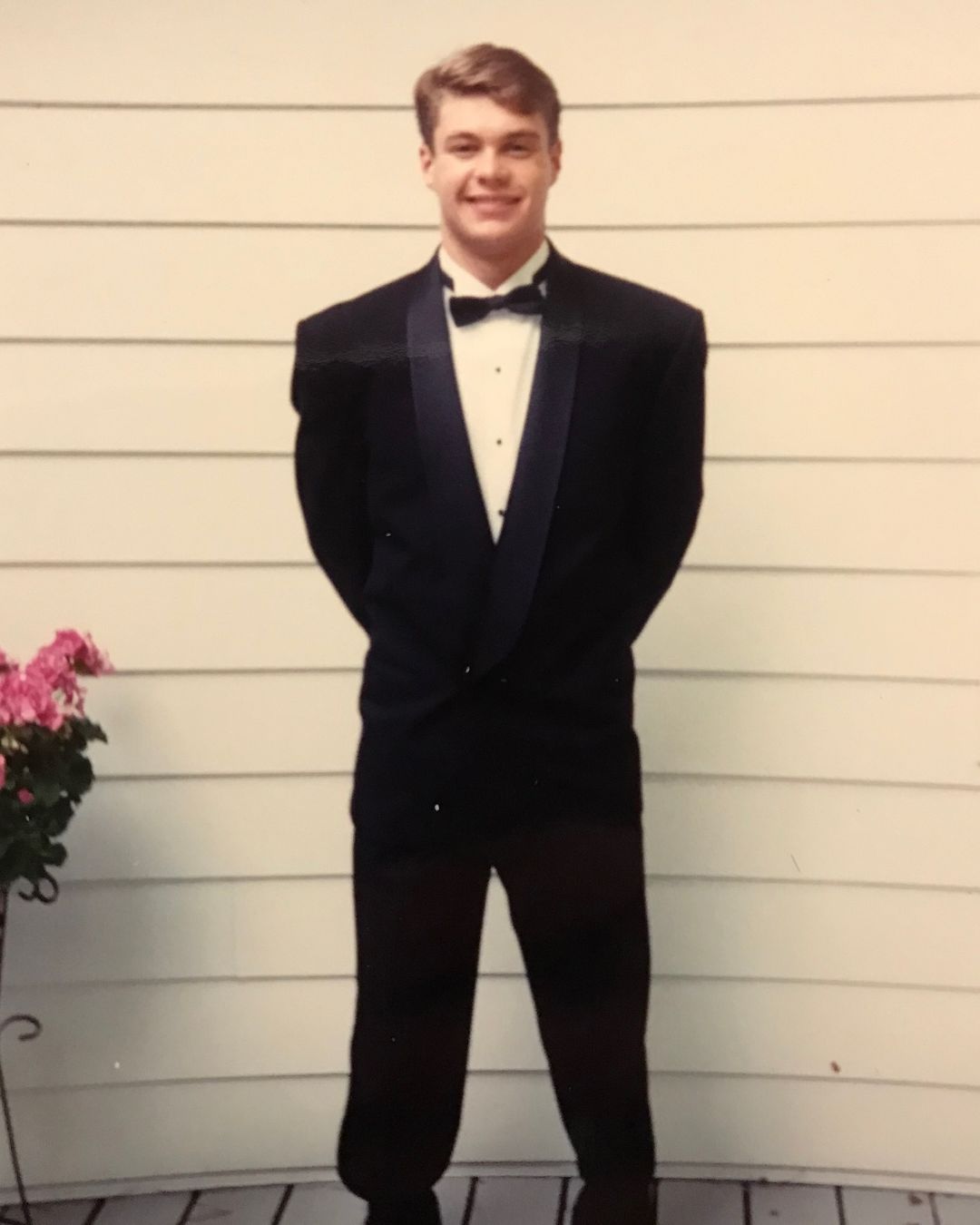 Above, Ryan Seacrest was all smiles while wearing a black tux in a throwback picture shared on his Instagram