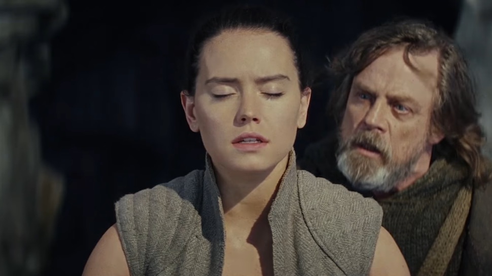 Luke Skywalker instructing a sitting Rey in The Last Jedi