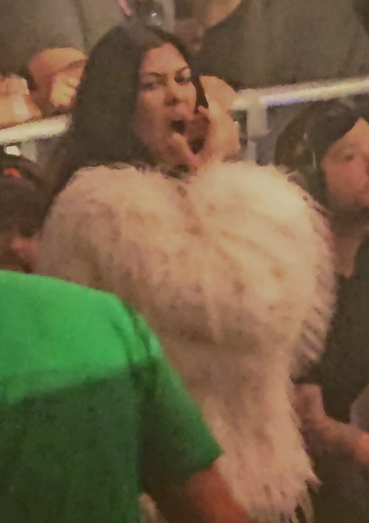 Kourtney Kardashian looking tired in the crowd of a Blink-182 concert in Las Vegas, Nevada, on Wednesday night