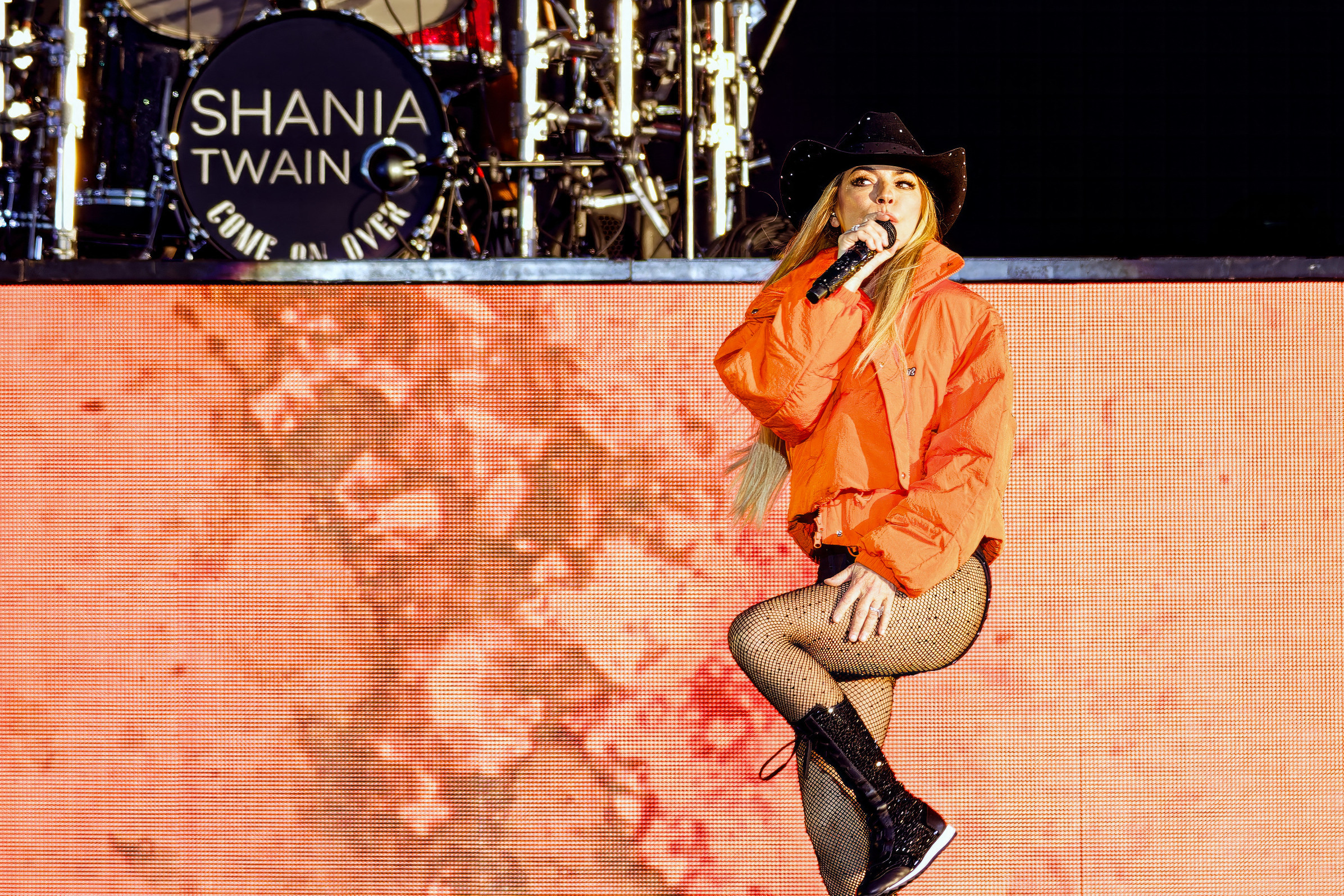 Shania Twain sported long lace-up black athletic shoes, and a sheer bodysuit at the Lytham Festival