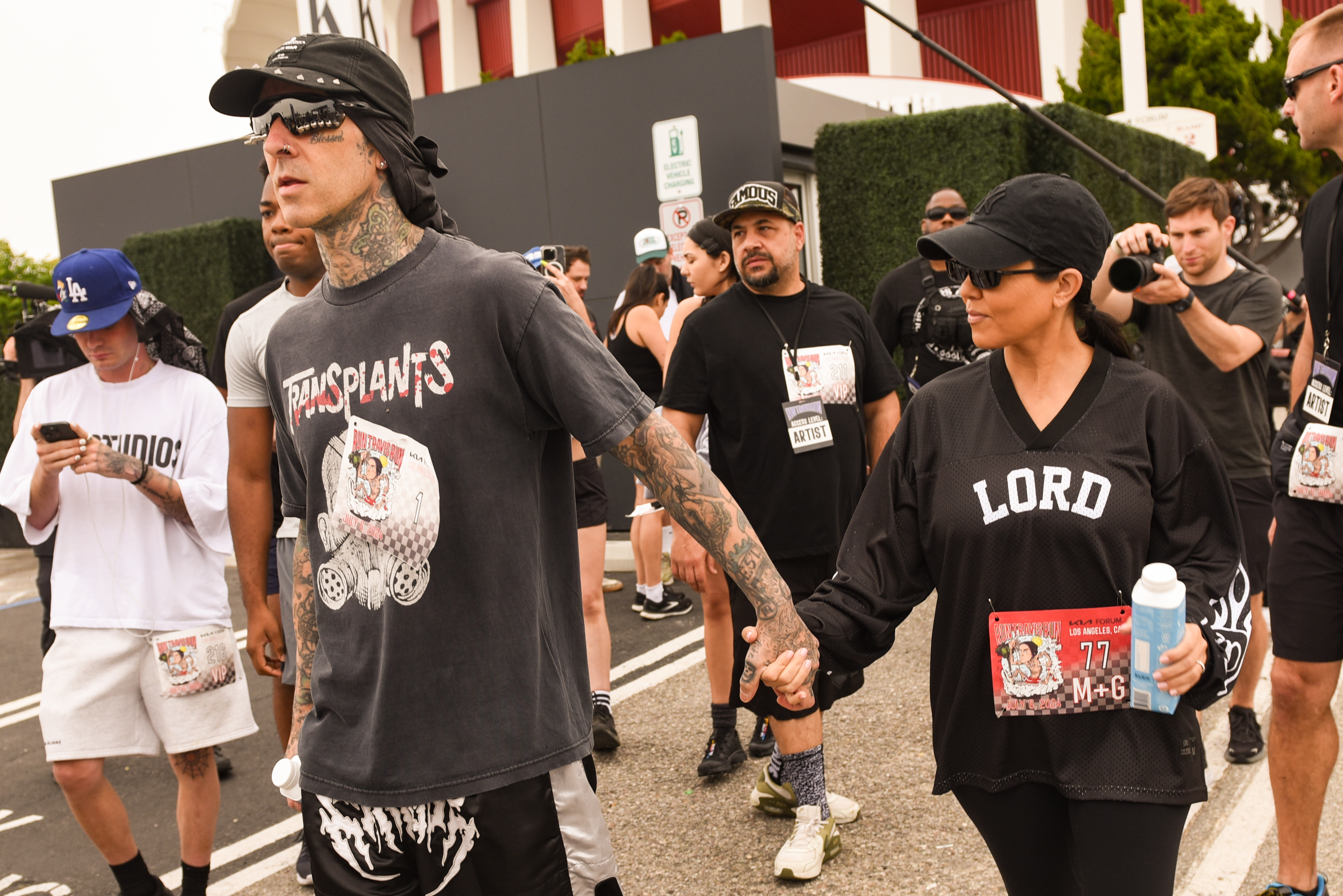 Even though Kourtney wore a shirt that seemed to reference her ex, her mind seemed to be focused on her husband as they held hands at the end of the race