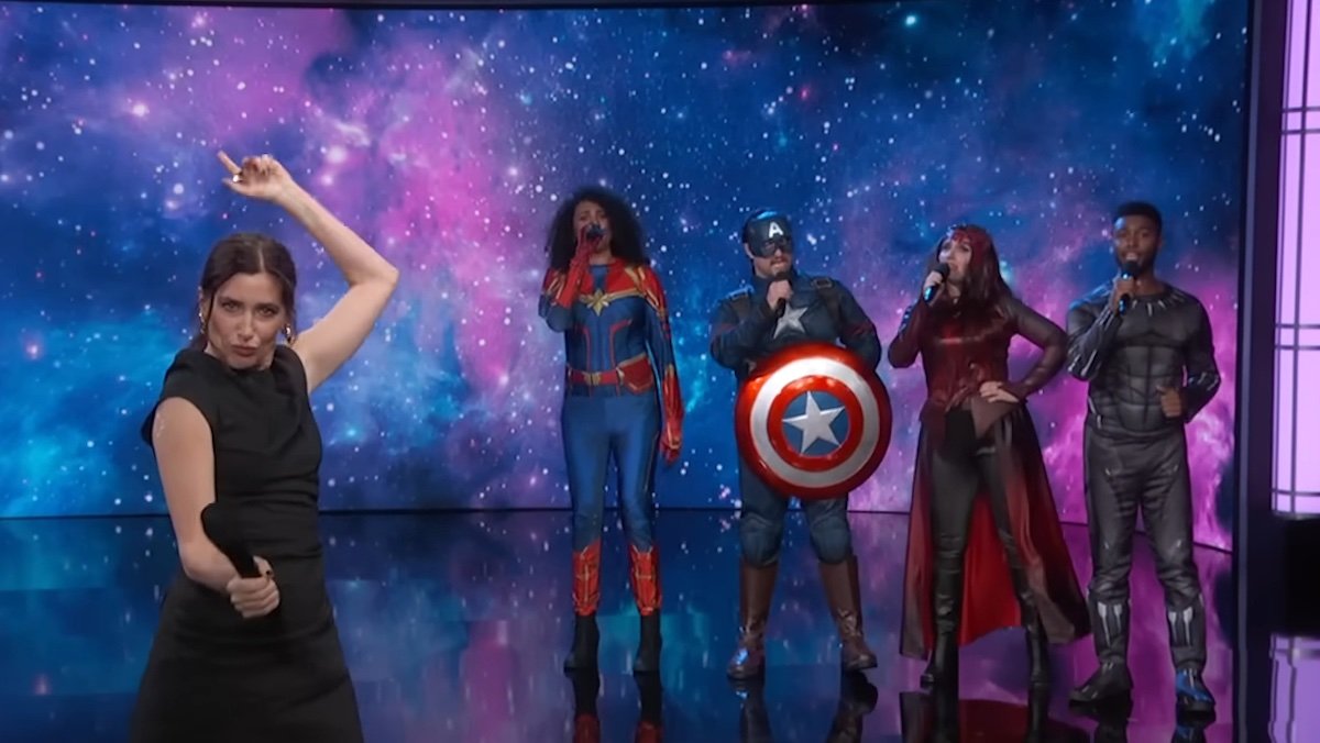 KAthryn Han sings in front of four people dressed like MCU characters and a celestial screen on Jimmy Kimmel Live