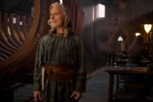 Cirdan the Shipwright working in his boathouse, played by Ben Daniels, in The Rings of Power