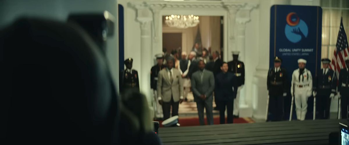Isaiah Bradley, Sam Wilson, and Joaquín Torres stand near a doorway at the White House in a still from the Captain America: Brave New World teaser trailer